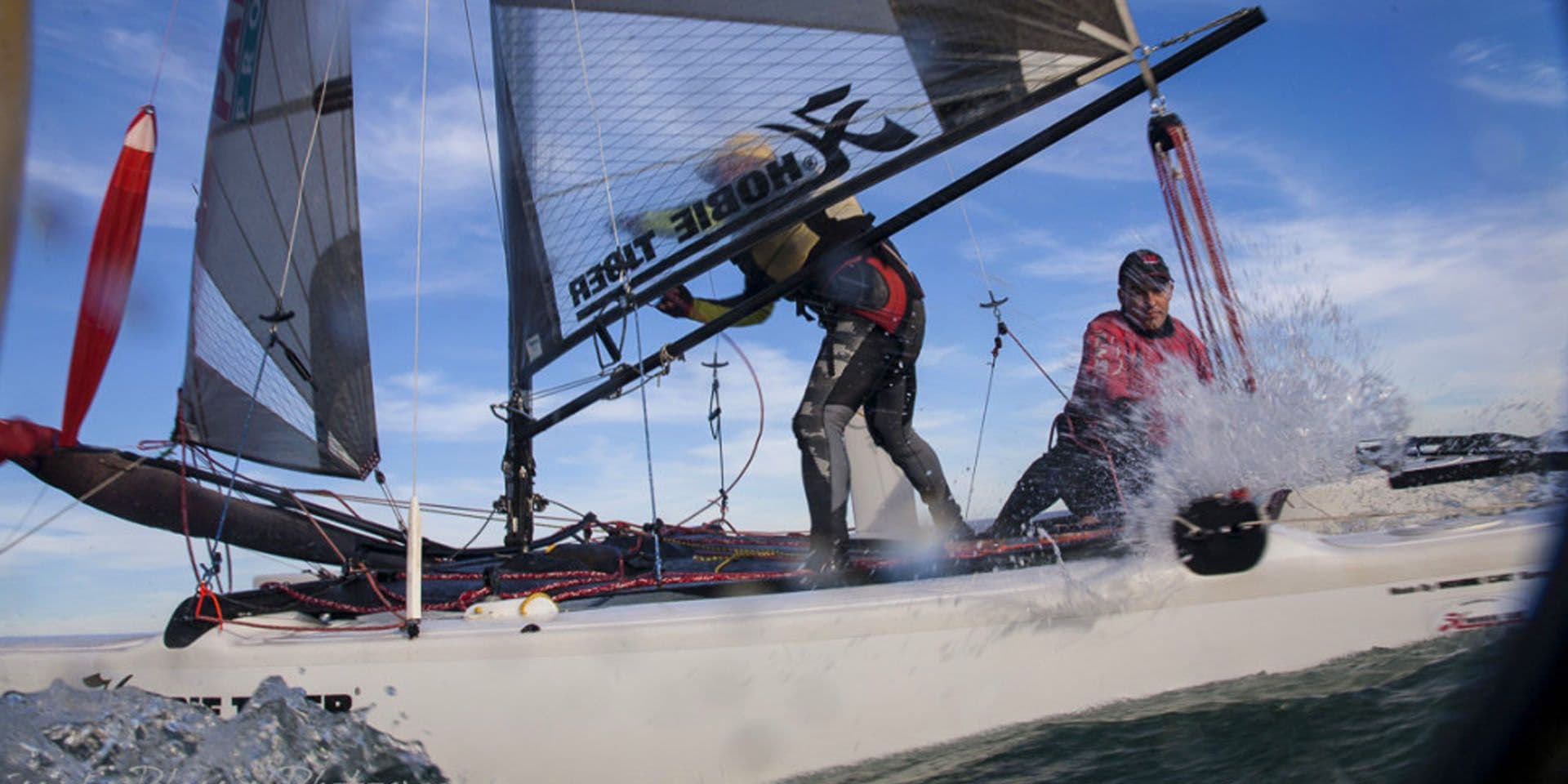 A Hobie Tiger crew powering through spray